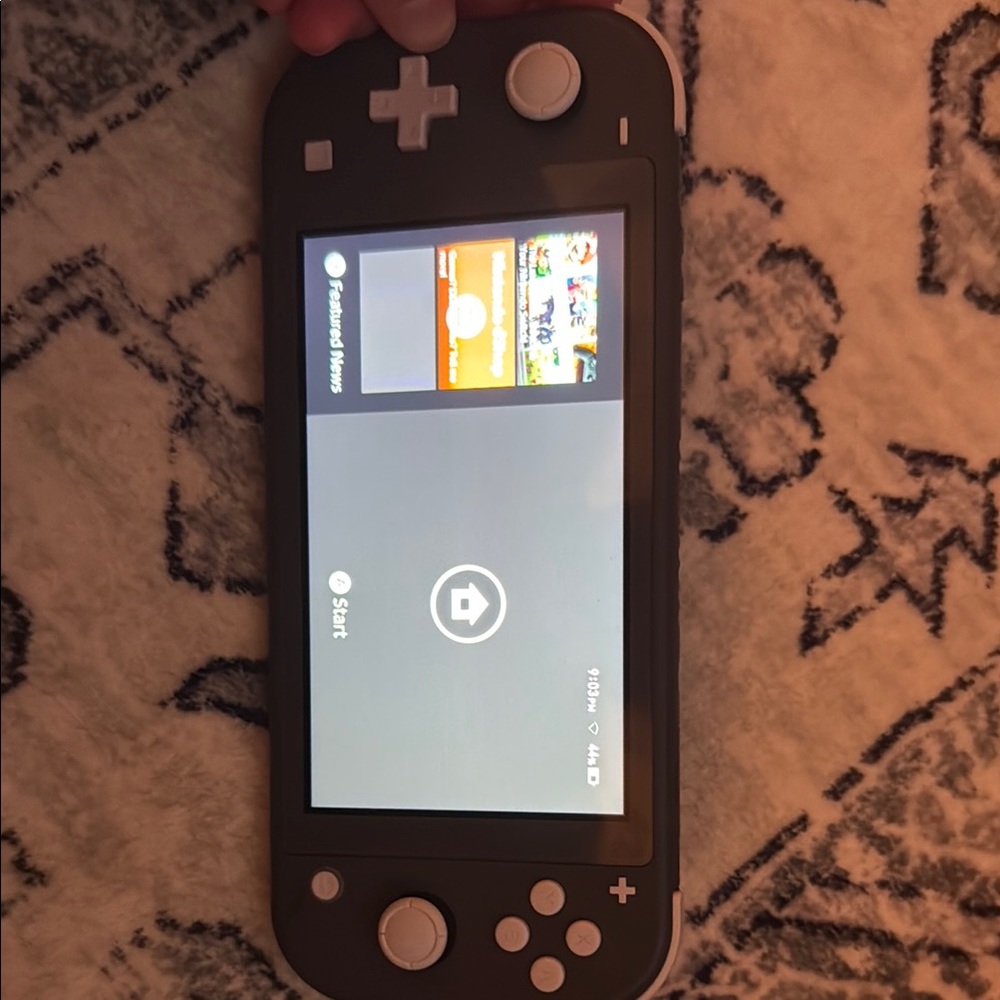 Nintendo Handheld Console Black and White Sleek Design